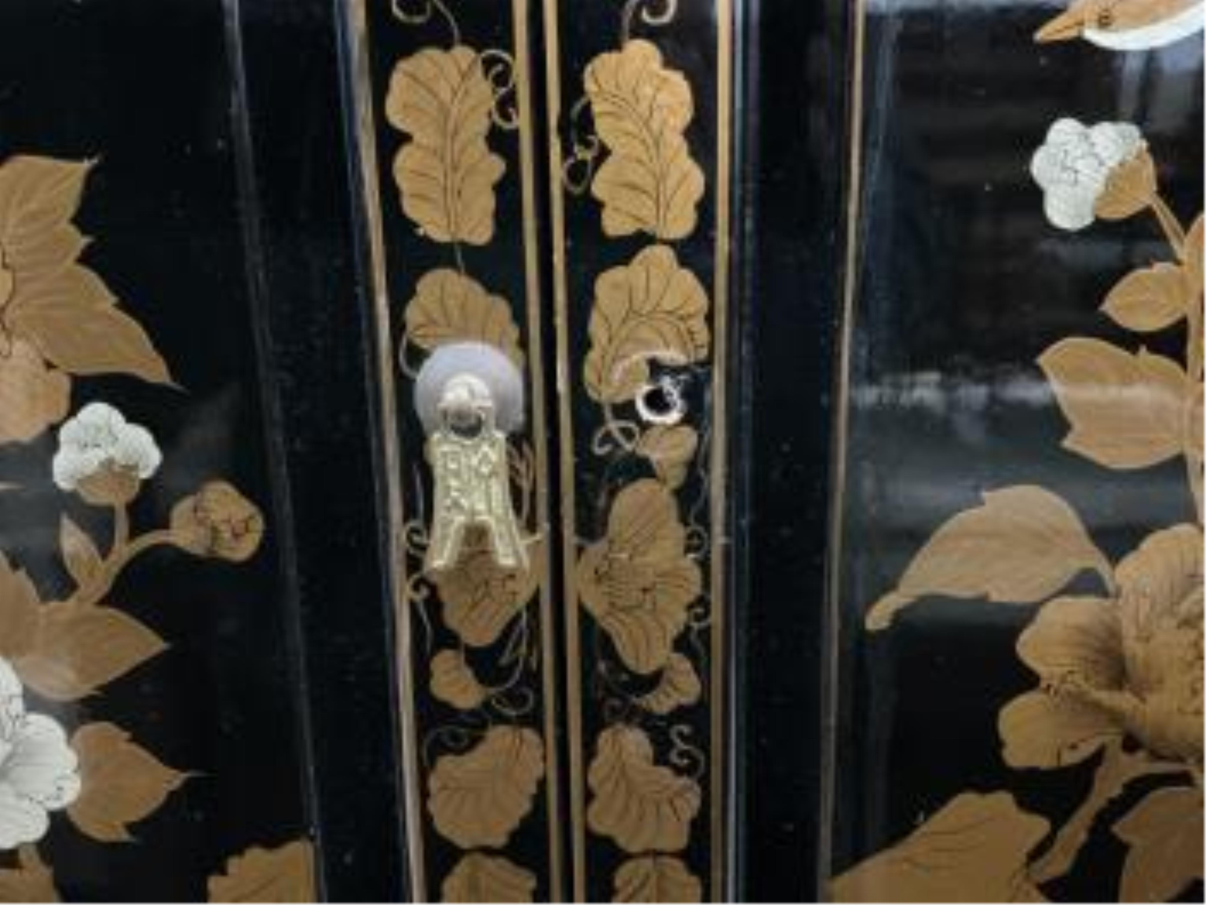 A small Chinese lacquered side cabinet, width 63cm, depth 31cm, height 67cm